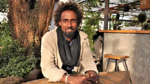 Peter Njoroge/BBC Portrait of a the cafe owner