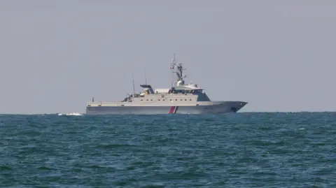 Jack Valpy/BBC A grey French navy ship in the English Channel 