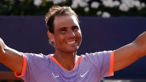 Rafael Nadal celebrates winning his first-round match at the Barcelona Open
