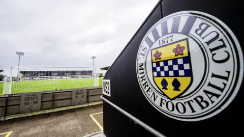 A stand emblazoned with St Mirren's club logo inside St Mirren Park - the pitch is visible in the background