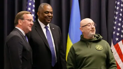 EPA Ukraine's Defence Minister Oleksii Reznikov (R) with US Defence Secretary Lloyd Austin (C) and German Defence Minister Boris Pistorius