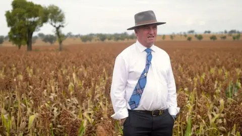 Reuters Former Australian deputy minister Barnaby Joyce stands in a field