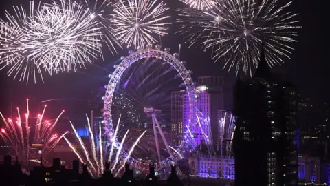 Fireworks explode over the London Eye