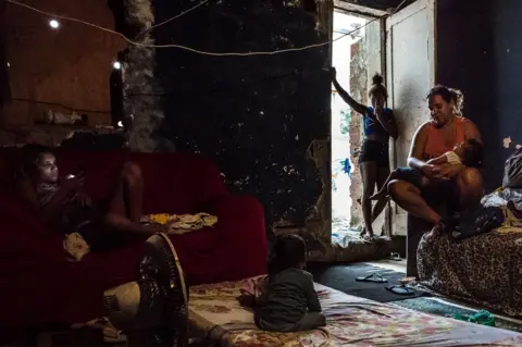 Tariq Zaidi Pamela (pictured on the left) has been living at the occupied building of IBGE for the last 15 years. Pamela's mother, Martha was the second resident to move into this occupied structure. 'Favela' Mangueira community, Rio de Janeiro, Brazil.