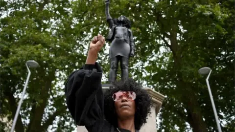 EPA Jen Reid pictured with her statue