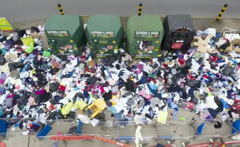 Chris Gorman / Big Ladder An aerial view of lots of rubbish discarded next to a recycling centre