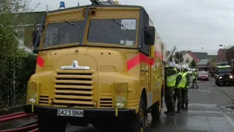 Troops and a fire engine