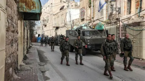 AFP Israeli soldiers patrol Shuhada street in the divided city of Hebron in the occupied West Bank (28 January 2020)