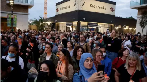 Getty Images Well-wishers attend a vigil for 28 year-old teacher Sabina Nessa