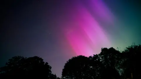 Rachael Image showing pink and purple lights in the skies above Bromley, south-east London