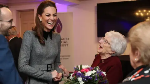 PA Media The Duchess of Cambridge shares a joke with Holocaust survivor Yvonne Bernstein after the UK Holocaust Memorial Day Commemorative Ceremony at Central Hall in Westminster