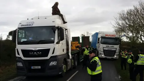 North Yorkshire Police Man on van in Kirby Misperton