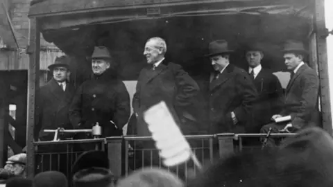 Woodrow Wilson, seen here on the back of a train, revived the practice of the spoken address