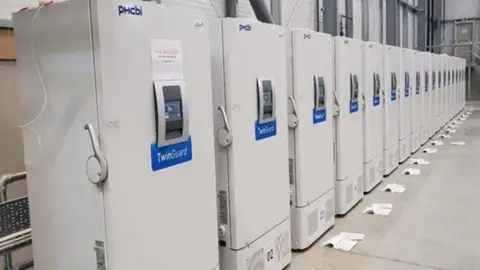 Public Heath England/PA Wire Freezers, at a secure location in the UK, which can each hold more than more than 80,000 doses of the Pfizer/BioNTech coronavirus vaccine