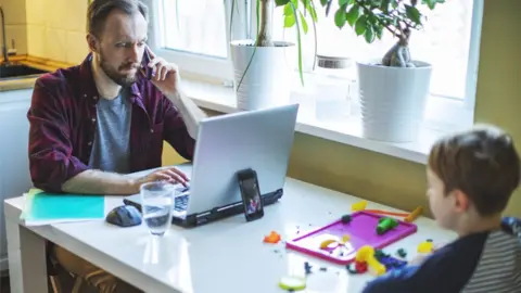Getty Images Father on computer