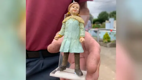 Model of girl left by Banksy at Merrivale Model Village