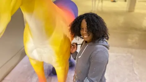 A unicorn being painted in Bristol's Broadmead shopping centre