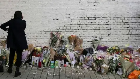 AFP Temporary memorial set up for Israel Ogunsola who was stabbed to death in Hackney on 4 April