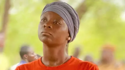 BBC A wife of one of the missing miners in Burkina Faso