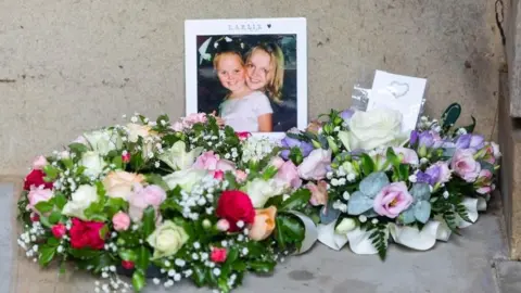 PA Media Flowers laid in the September 11 Memorial Garden in Grosvenor Square, London