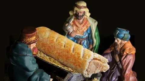 Greggs Greggs sausage roll in nativity scene