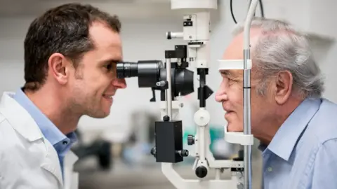 Getty Images Older man getting an eye test