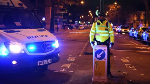 Getty Images Police cordon after stabbing in London