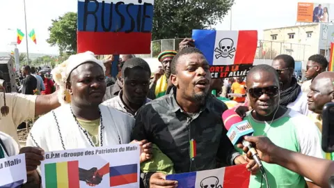 Getty Images Malians stage a protest against France at the Independence Square in Bamako