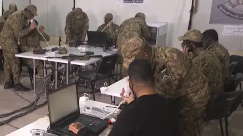 Telegram Masked men in military uniforms