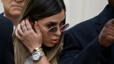 AFP via Getty Images Emma Coronel Aispuro walks out of Brooklyn Federal Court on July 17, 2019 after her husband's sentencing