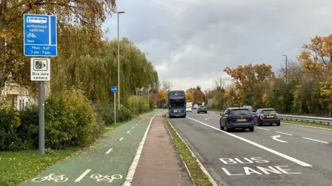 BBC Photo of the bus lane camera sign on the A40 into Cheltenham just beyond Benhall roundabout
