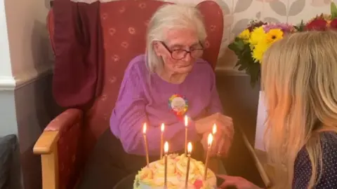 Kathleen presented with birthday cake