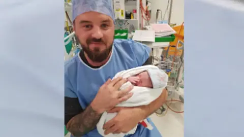 Family photo Kane Collings with baby Frankie