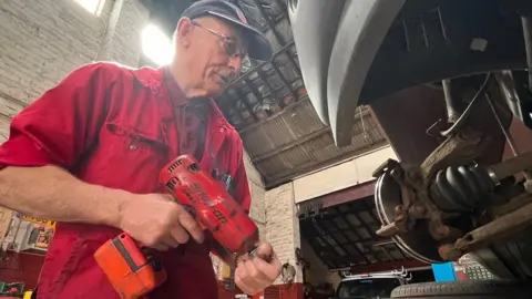 Mo Kitchen changing a brake disc