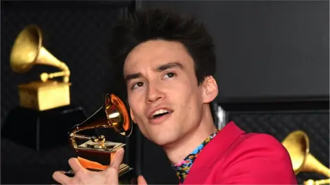 Getty Images Jacob Collier holding a Grammy