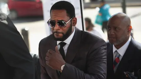 Getty Images R. Kelly arriving at a court hearing in 2019