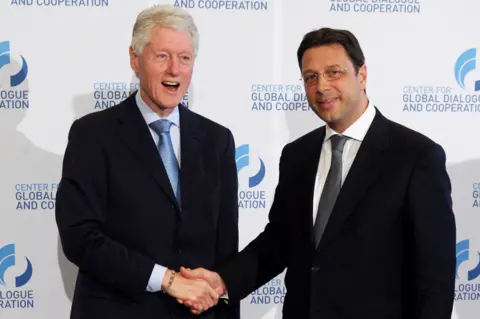 Getty Images Bill Clinton with Stephan Roh