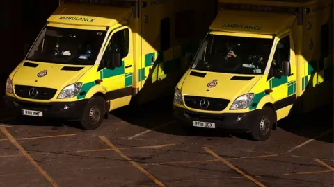 ADRIAN DENNIS/AFP ambulances