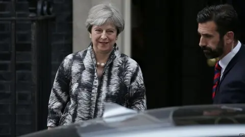 AFP Theresa May leaving Downing Street
