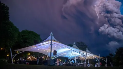 Randolf Evan Photography Marquee with volcano and lightning in the background