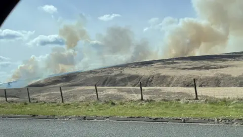 Kevin Ridings Smoke rising from fire on Marsden Moor