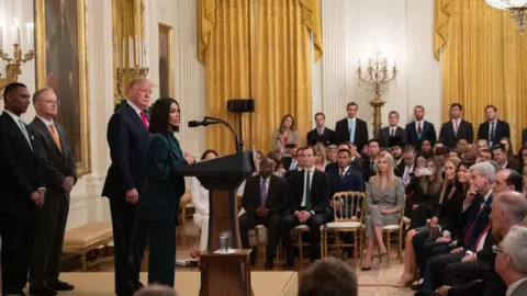 Getty Images Kim Kardashian speaks alongside President Trump during a criminal justice reform event