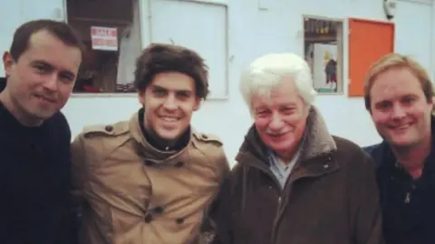 Daniel Bennett Trevor Emery at a football match with his grandson Daniel Bennett (left) and two other men