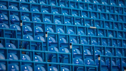 Getty Images Empty safe standing seats before the Premier League match between Chelsea FC and Crystal Palace at Stamford Bridge in January 2023. 