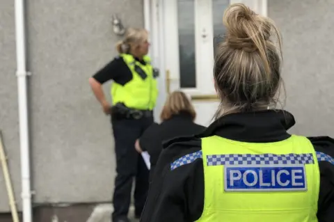 Northumbria Police Police visit a Wallsend house to warn a family they will be evicted if they do not control their children