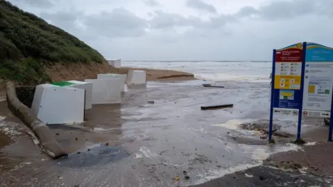 Richard Walden Beach huts on their sides at Woolacombe beach