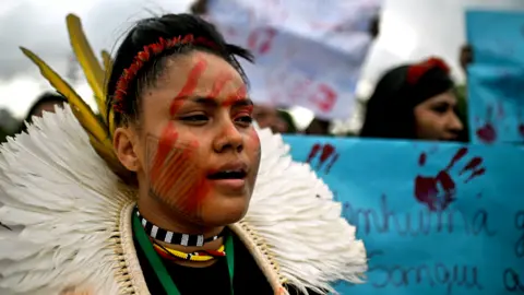 EPA Indigenous people of different ethnic groups participate in a march for land demarcation, and against violence on indigenous lands and agribusiness, one day before the summit of the Amazon countries, in Belem, Para, Brazil, 07 August 2023.