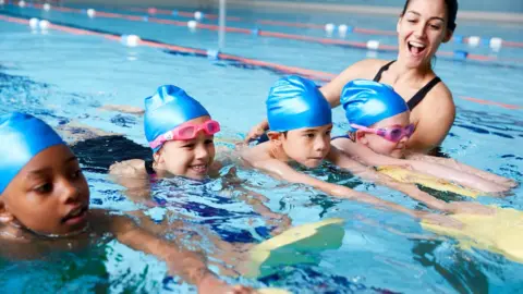 Getty Images children's swimming lesson in pool