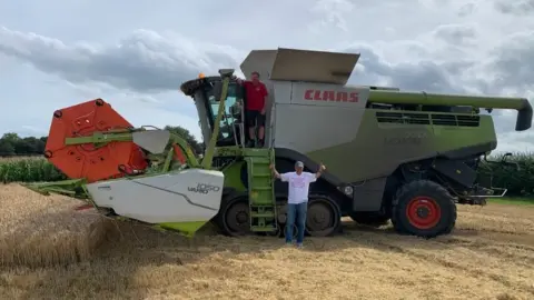 Jane Kohler Malcolm Metcalf and a combine harvester