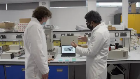 BBC Scientists working in the lab